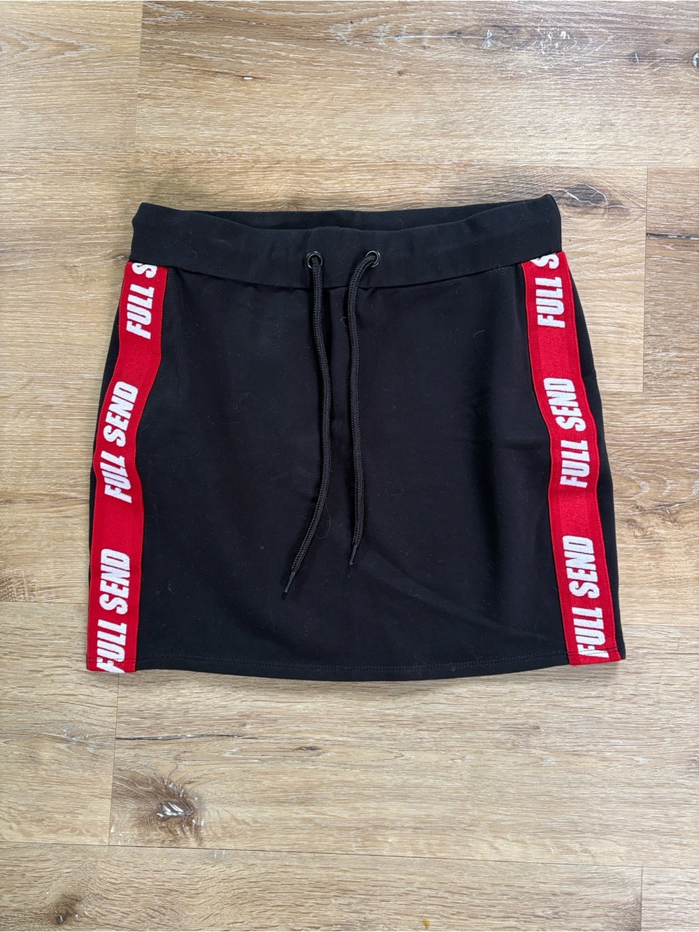 Full Send Black Mini Athletic Skirt with Red Side Stripe
